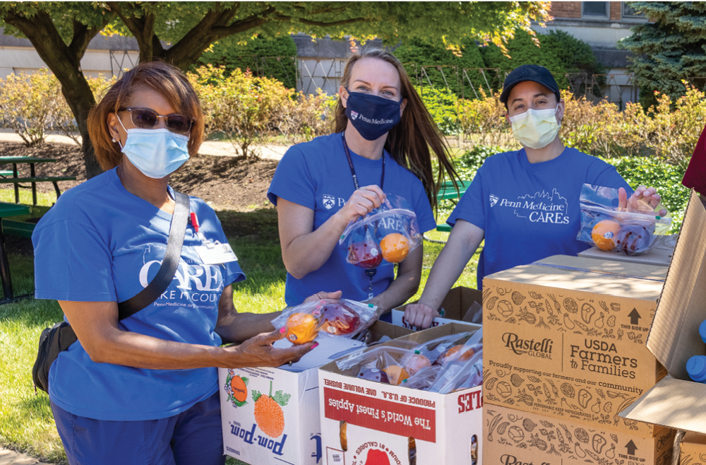 Laura Lombardo (second from left) is a regular volunteer at community events along with other Penn Medicine staff.